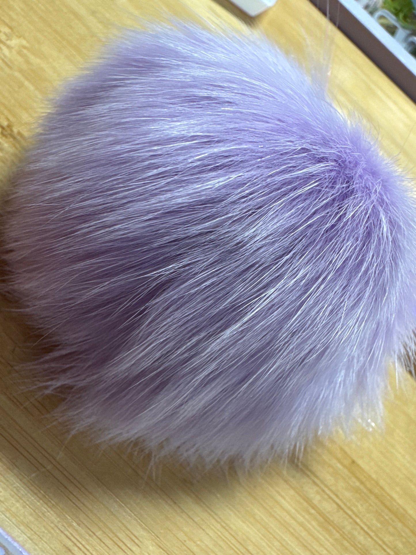 Foxtail pom-pom with charm