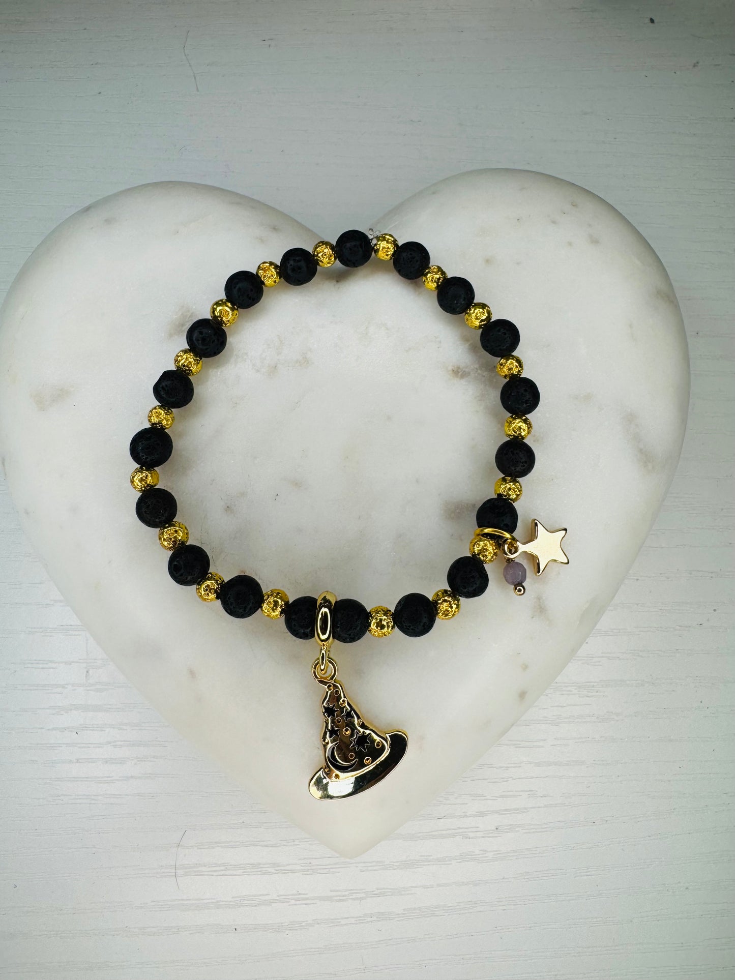 Lava stones and gold hematite bracelet with charms