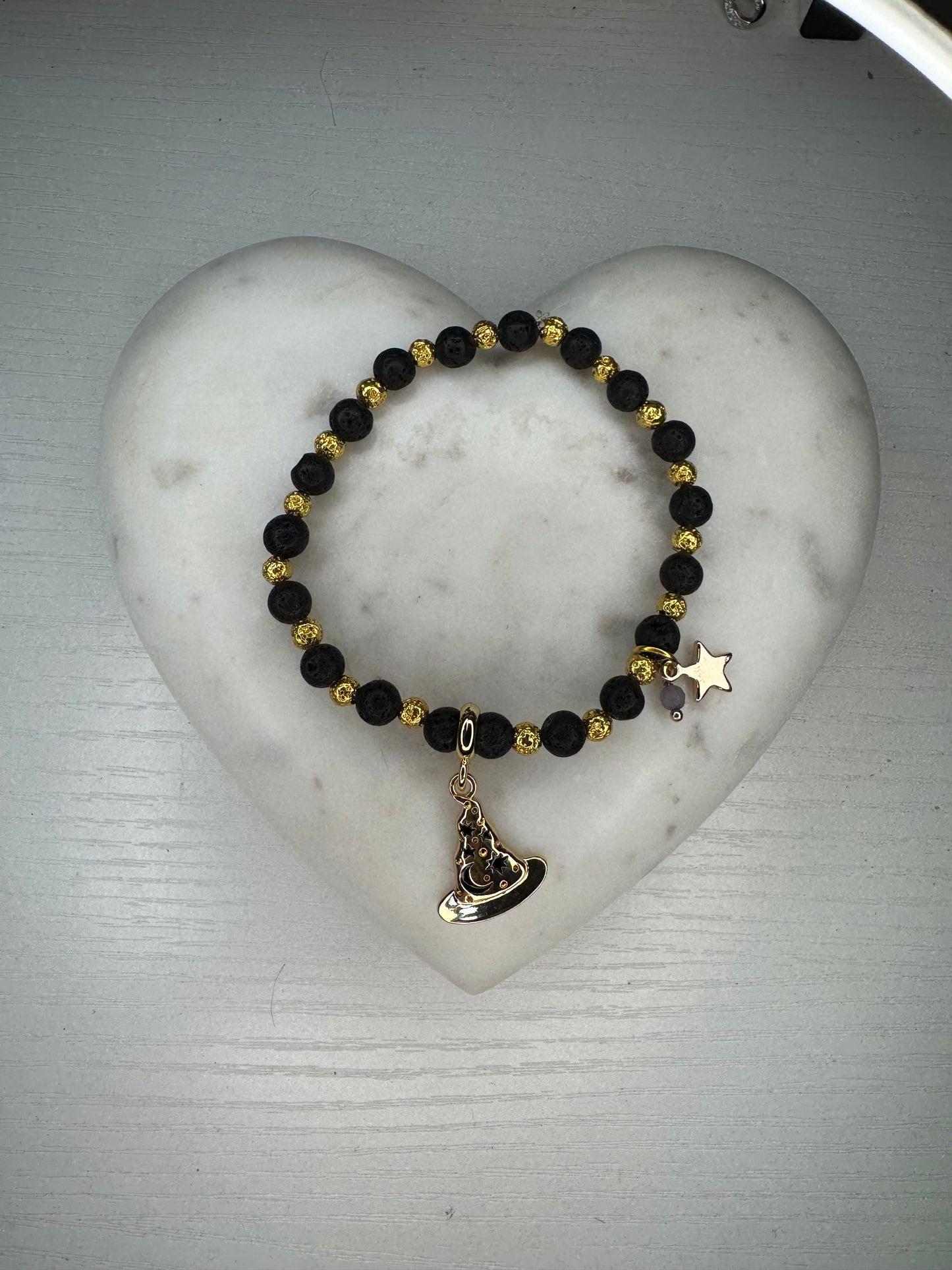 Lava stones and gold hematite bracelet with charms