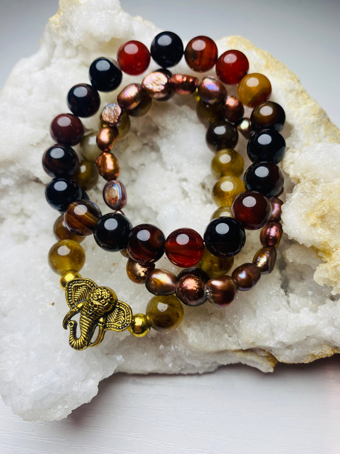 Three piece all natural elephant, charm bracelet set