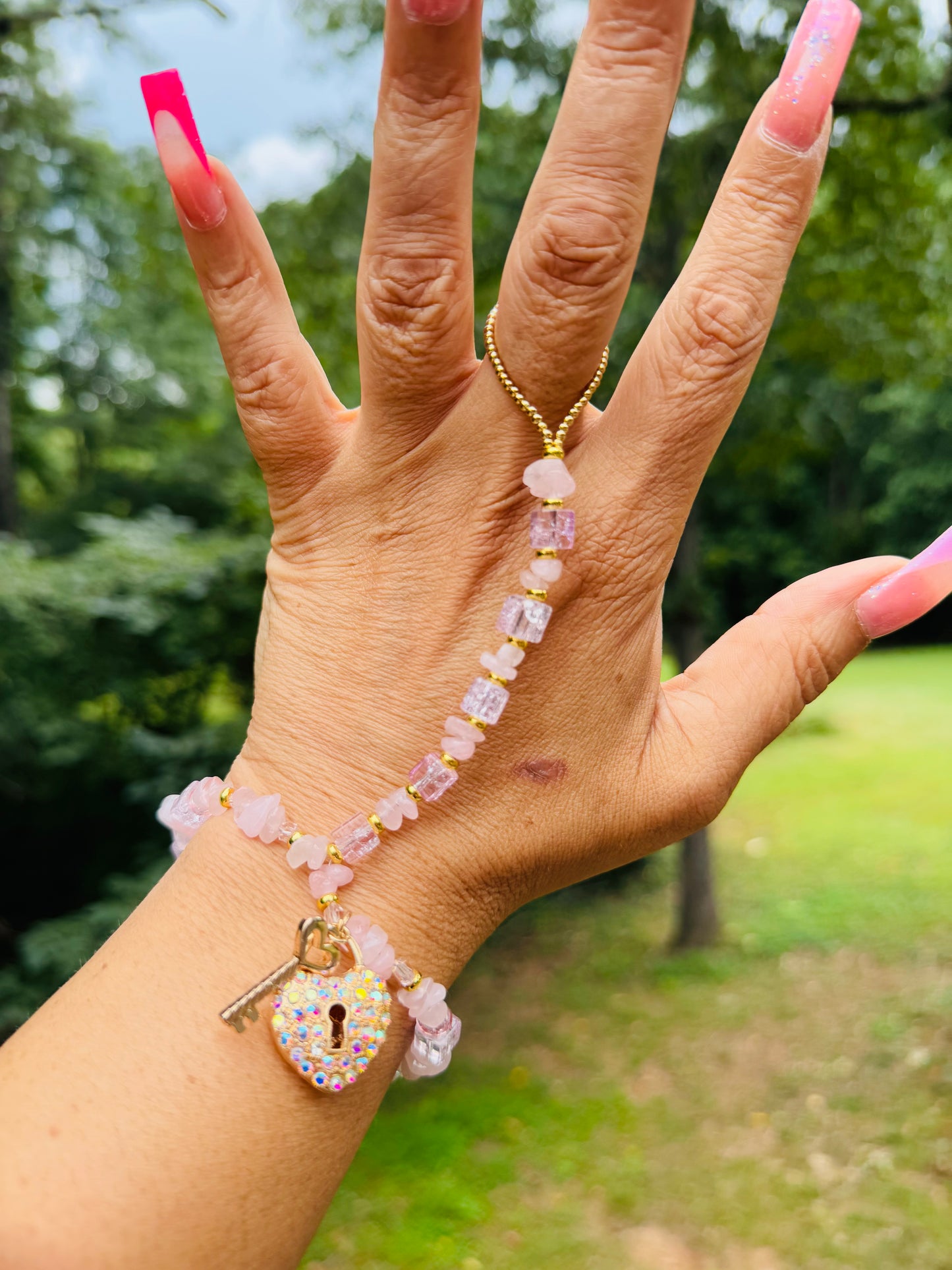 Custom made one of a kind pink ice hand adornment