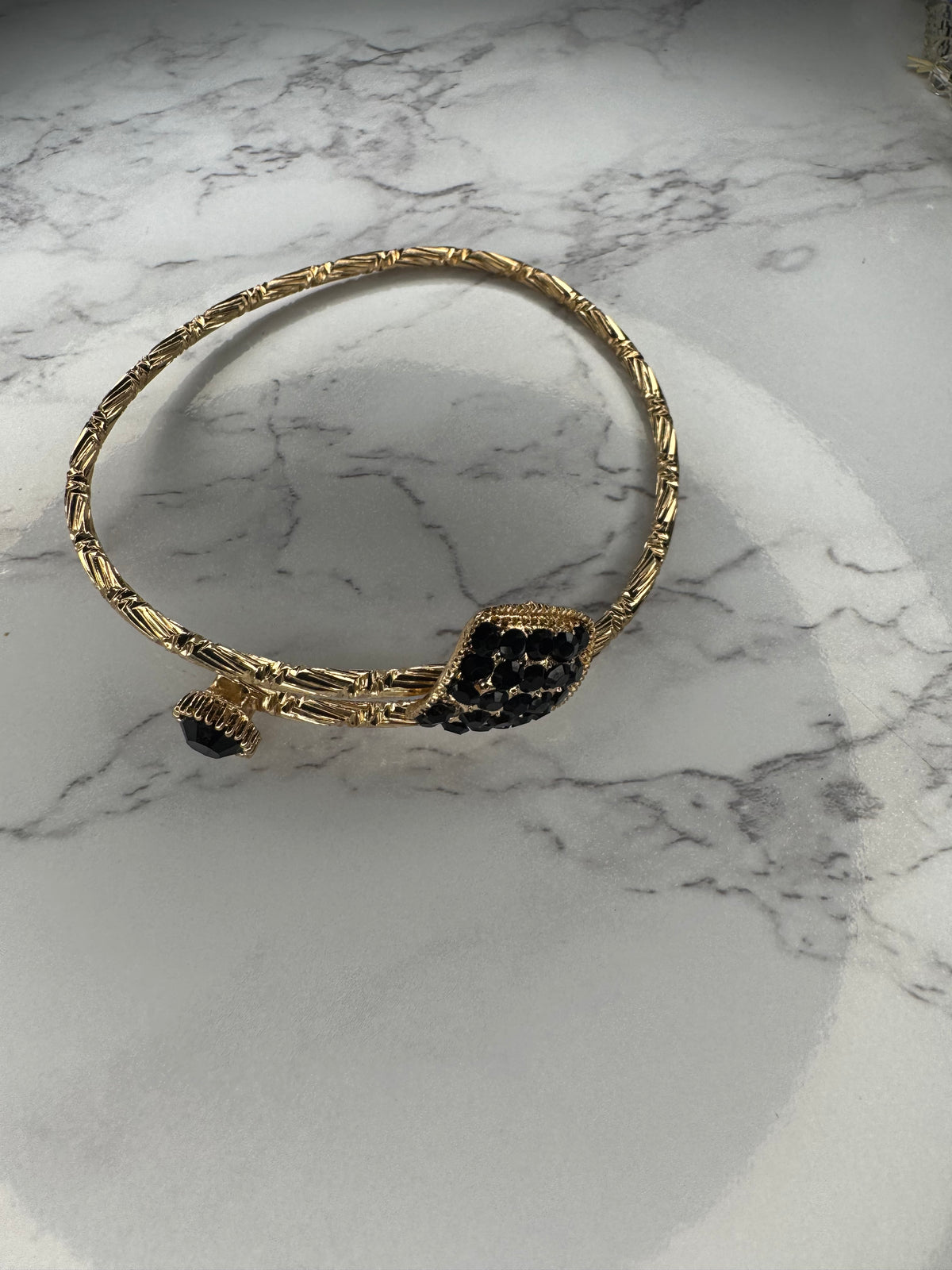 Gold bangle bracelet with black Onyx