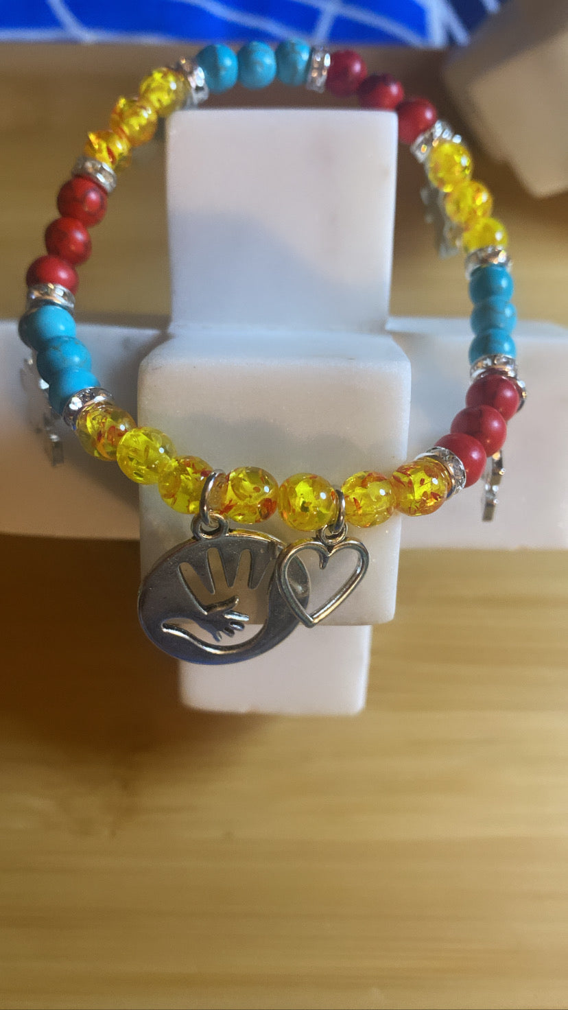 Autism awareness, bracelets pastor Reed