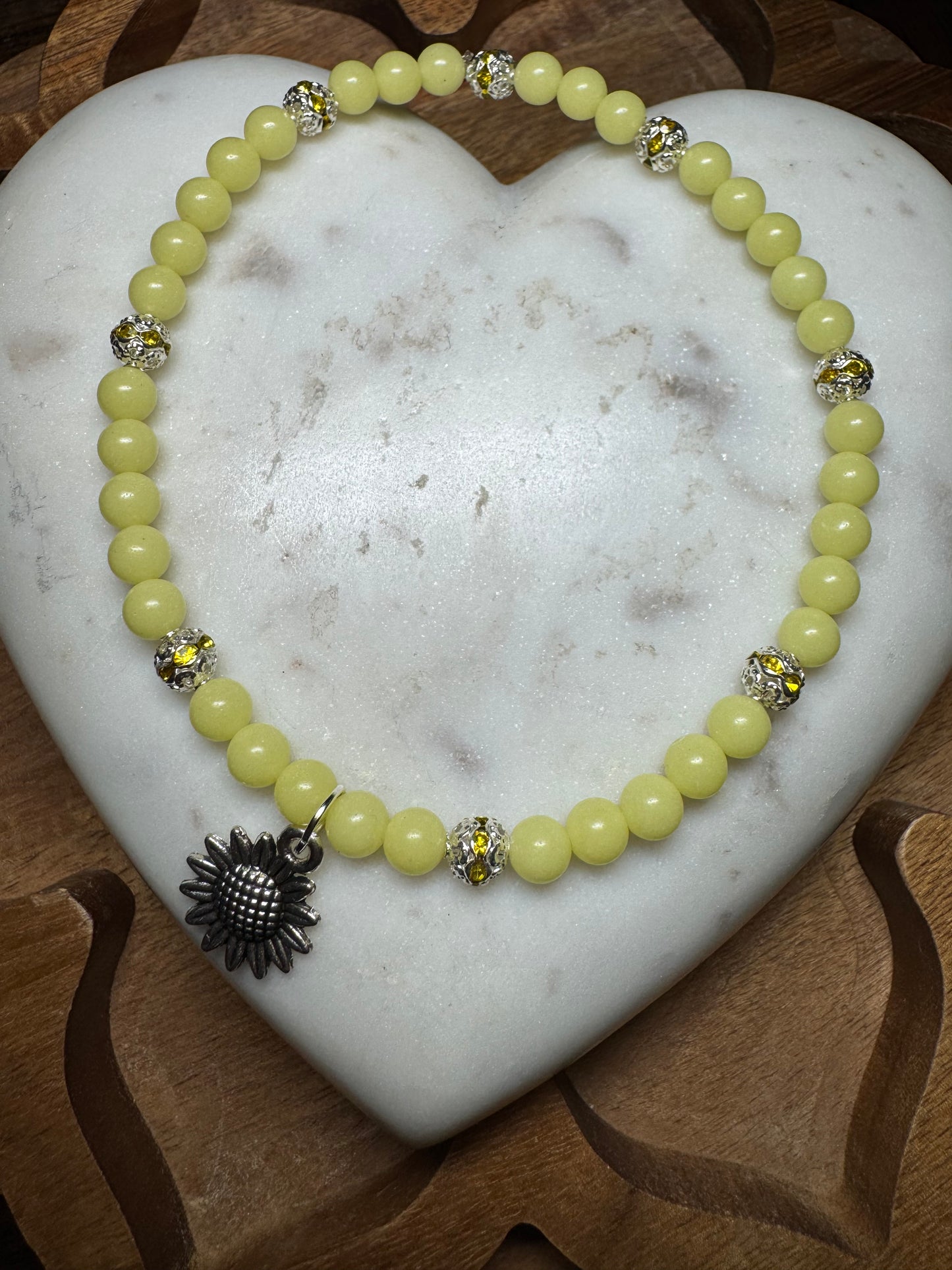 ￼ blowing the dark sunflower charm anklet