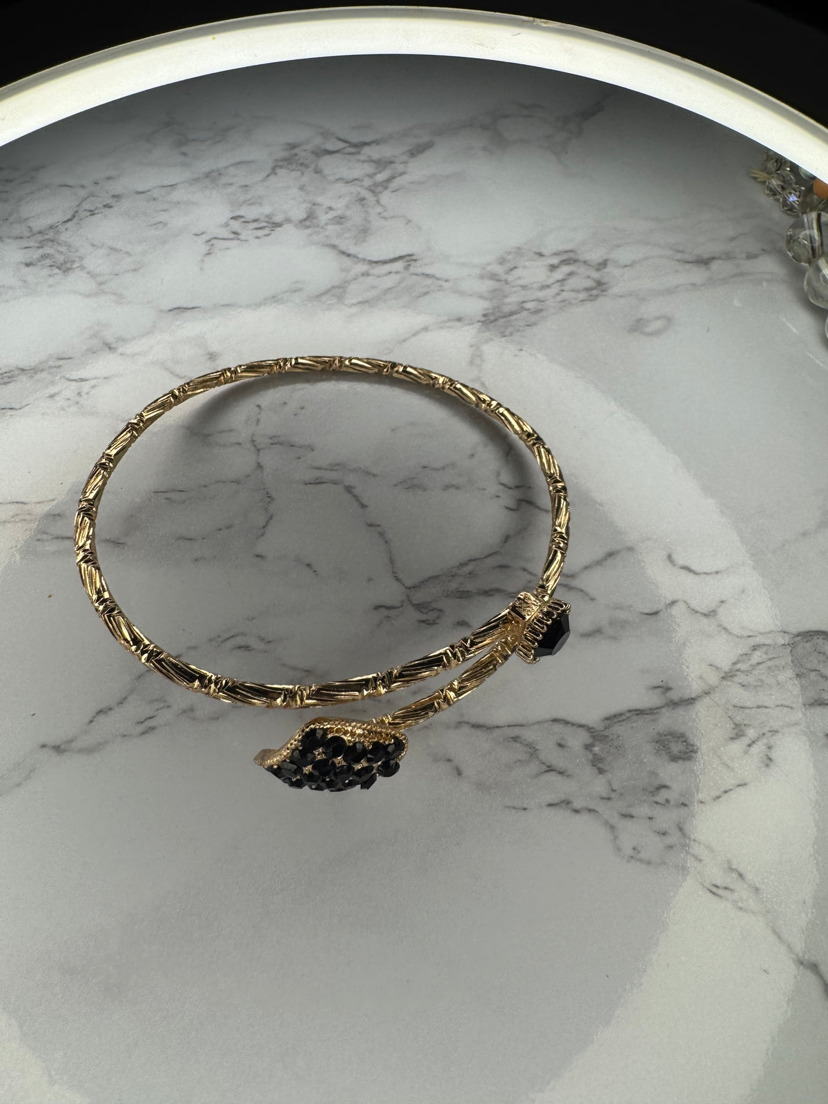 Gold bangle bracelet with black Onyx