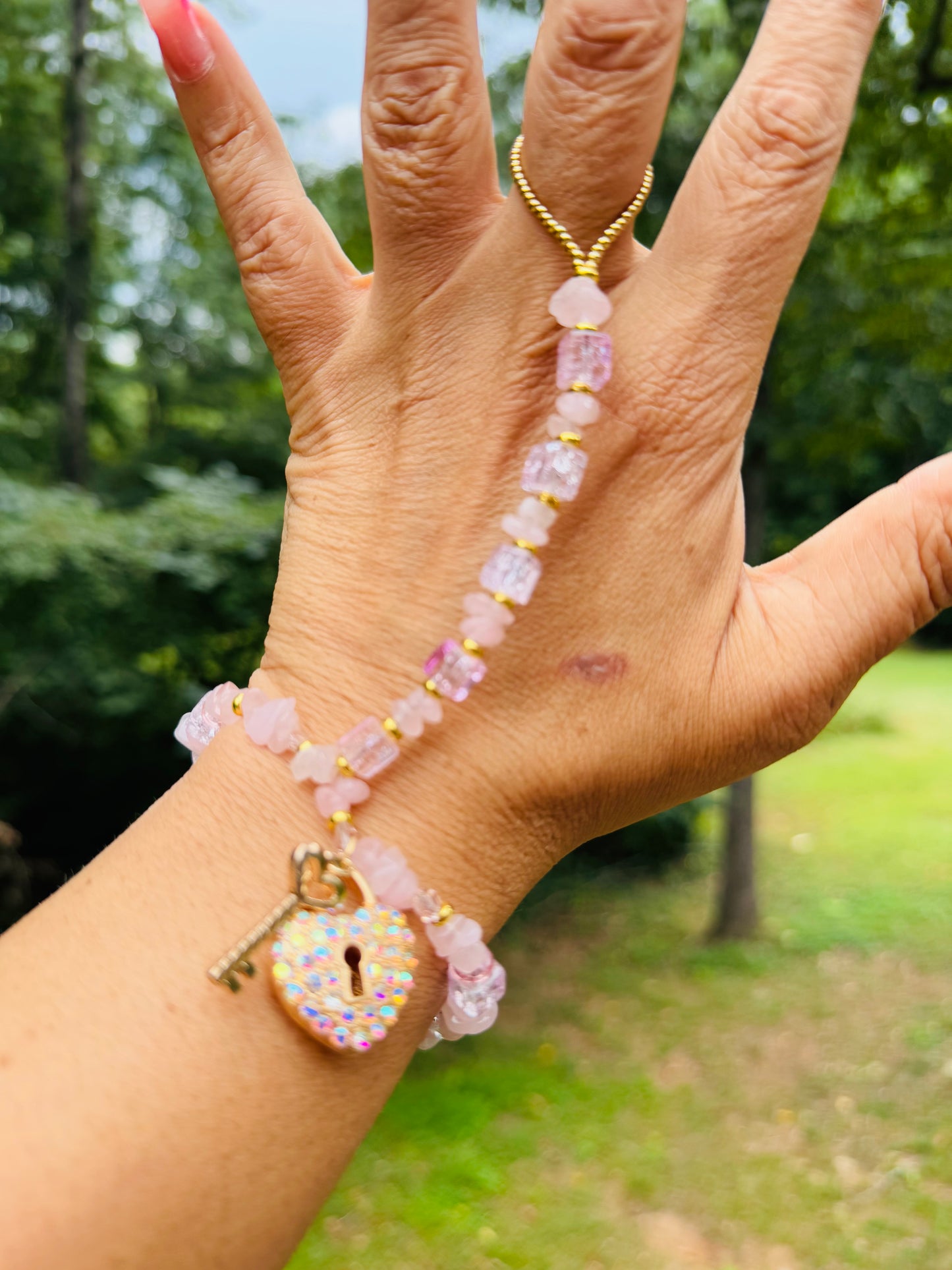 Custom made one of a kind pink ice hand adornment
