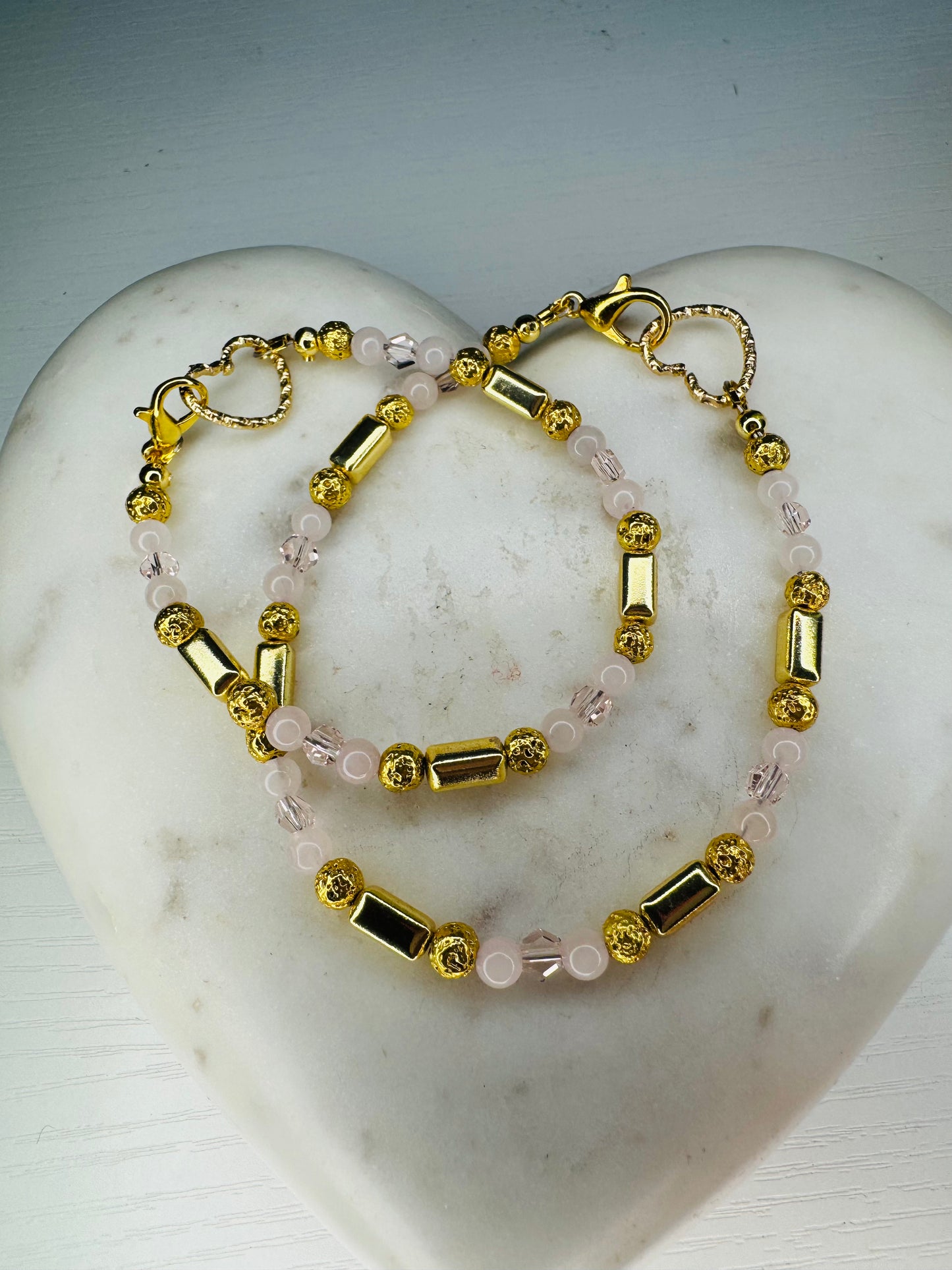 Bracelet and anklet set set with Hematite stones and rose quartz stones.