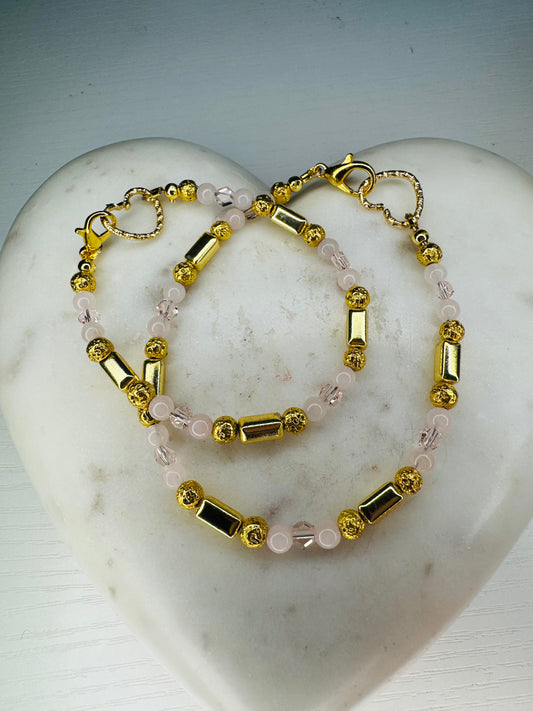 Bracelet and anklet set set with Hematite stones and rose quartz stones.