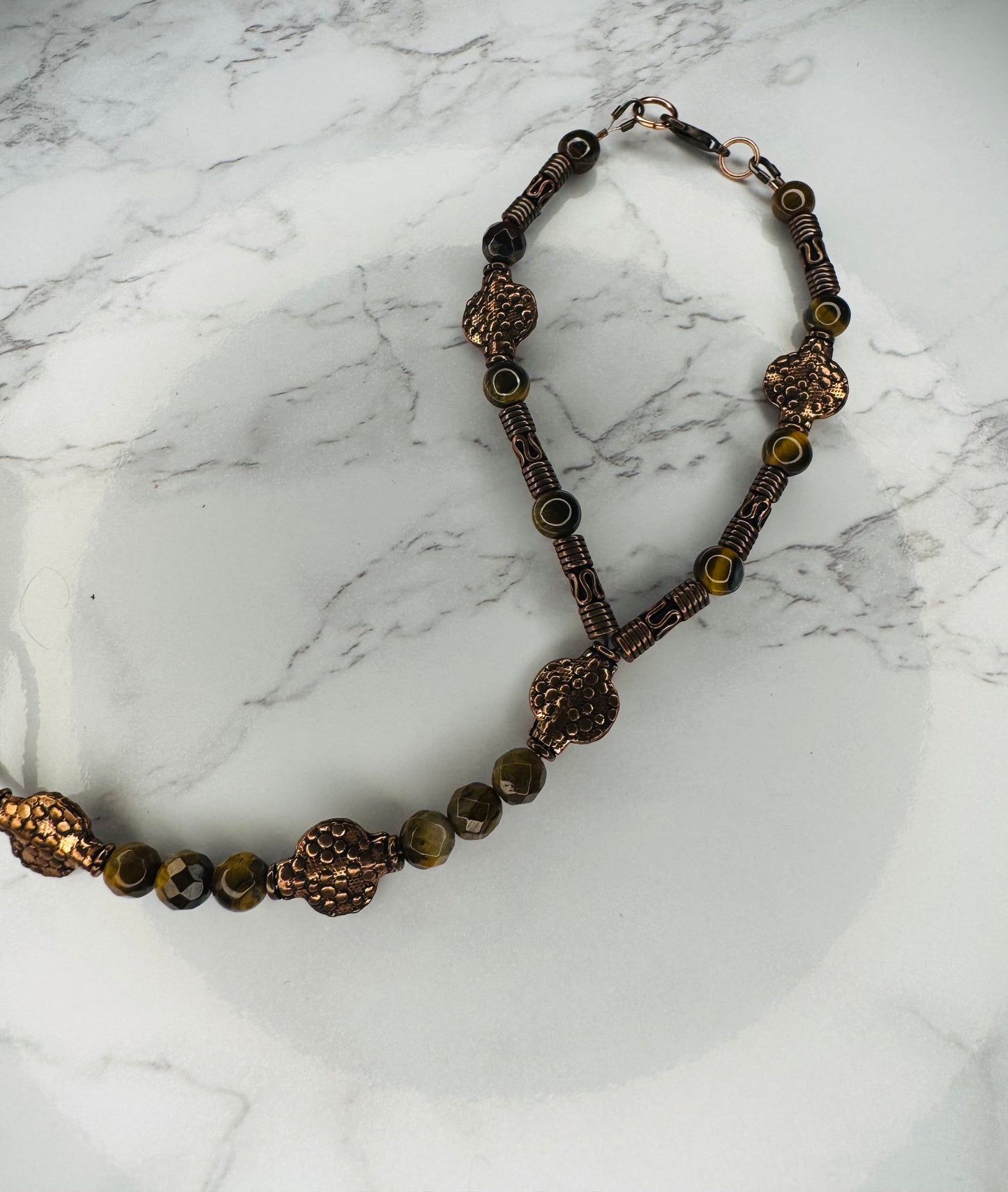 Copper hand dormant with tagger eye stones
